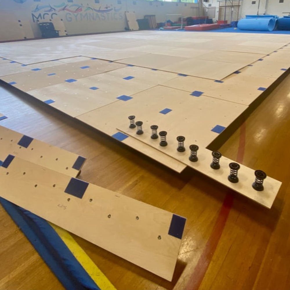 ATX spring floor being installed in a gymnastics gym