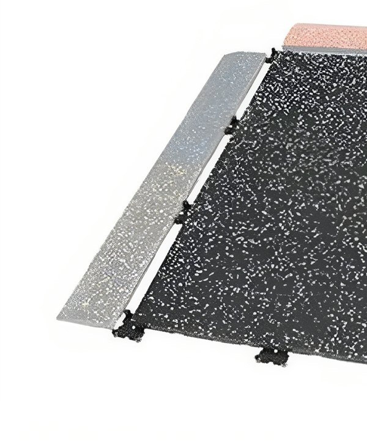 A wedge edge running along the exposed side of a roll-out mat on a gym floor